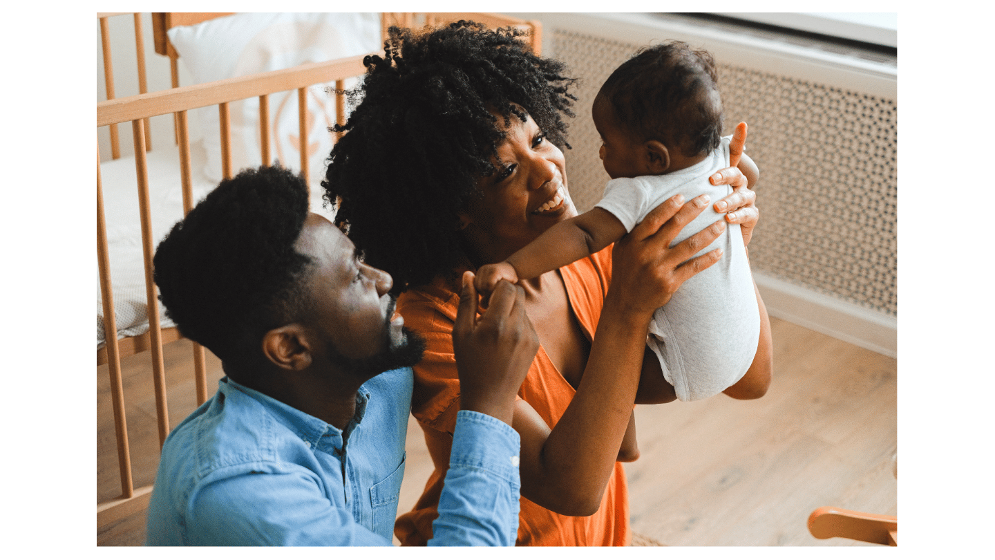 Family with baby by crib